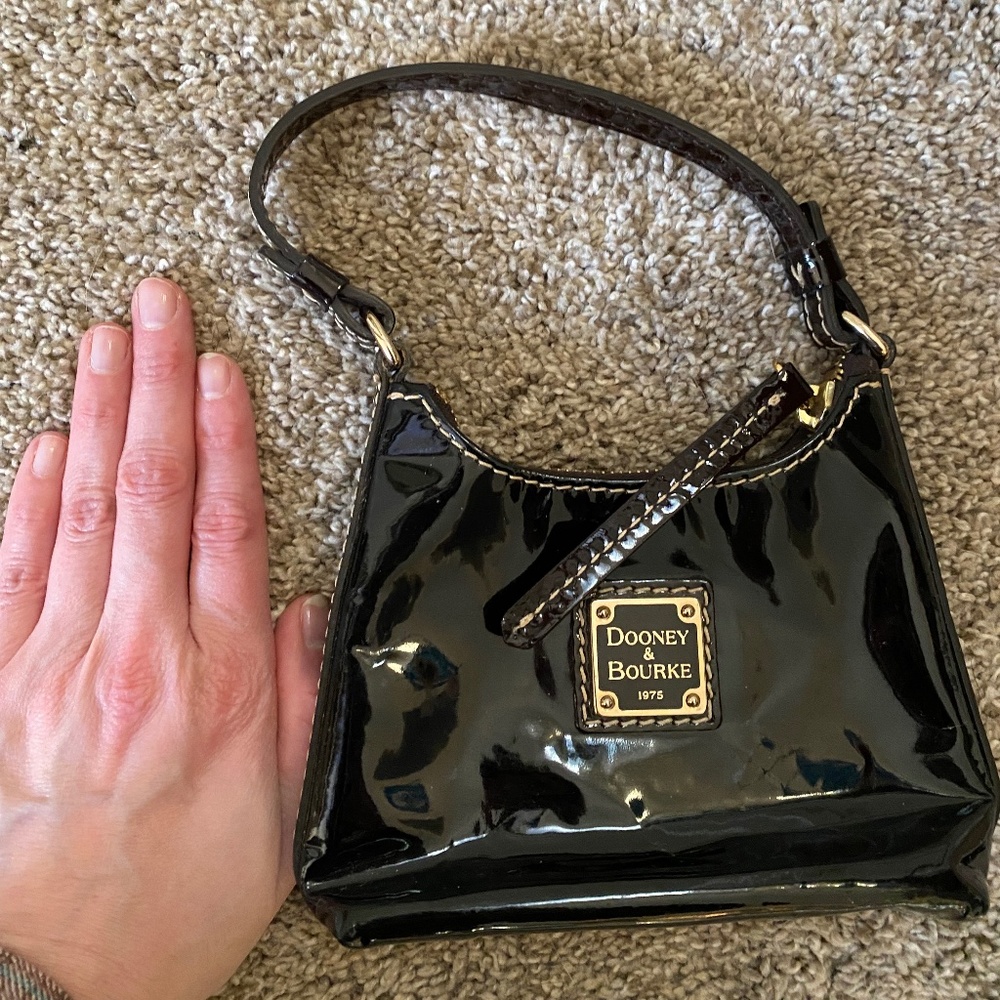 Small black leather Dooney & Burke clutch
